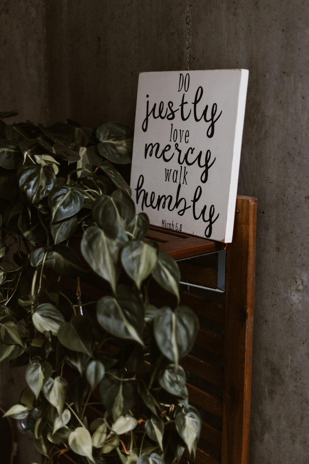 Conclusion by Bible Verse Daily do justly love mercy walk humbly signage leaning on wall beside plants