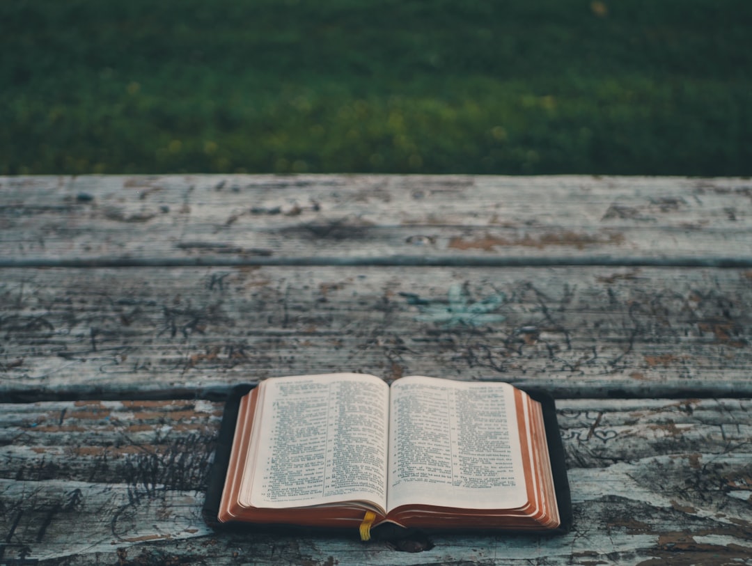 FAQ: Your Burning Questions About Today’s Bible Verse and Daily Devotionals Answered ❓📚 by Bible Verse Daily black book on gray wooden table