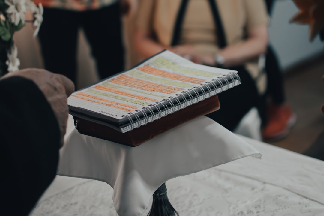 person holding black and white book